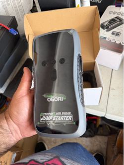 Jump starter with air compressor