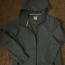 dark green Nike Tech