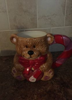 Valentines bear shaped mug holding heart
