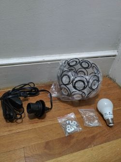 Black Metal Hollow Crystal Pendant Light With A Plug-In Cord And Light To Make High Or Low Dim