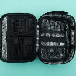 TRAVEL TOILETRY BAG: 8.5"X6.5"X3.25". 3-DIGIT COMBO LOCK FOR SECURITY. LIKE NEW.