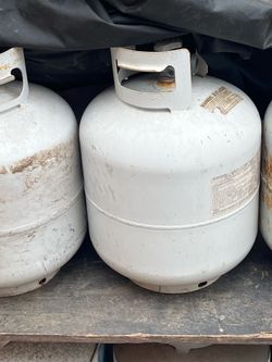 Three empty propane tanks empty
