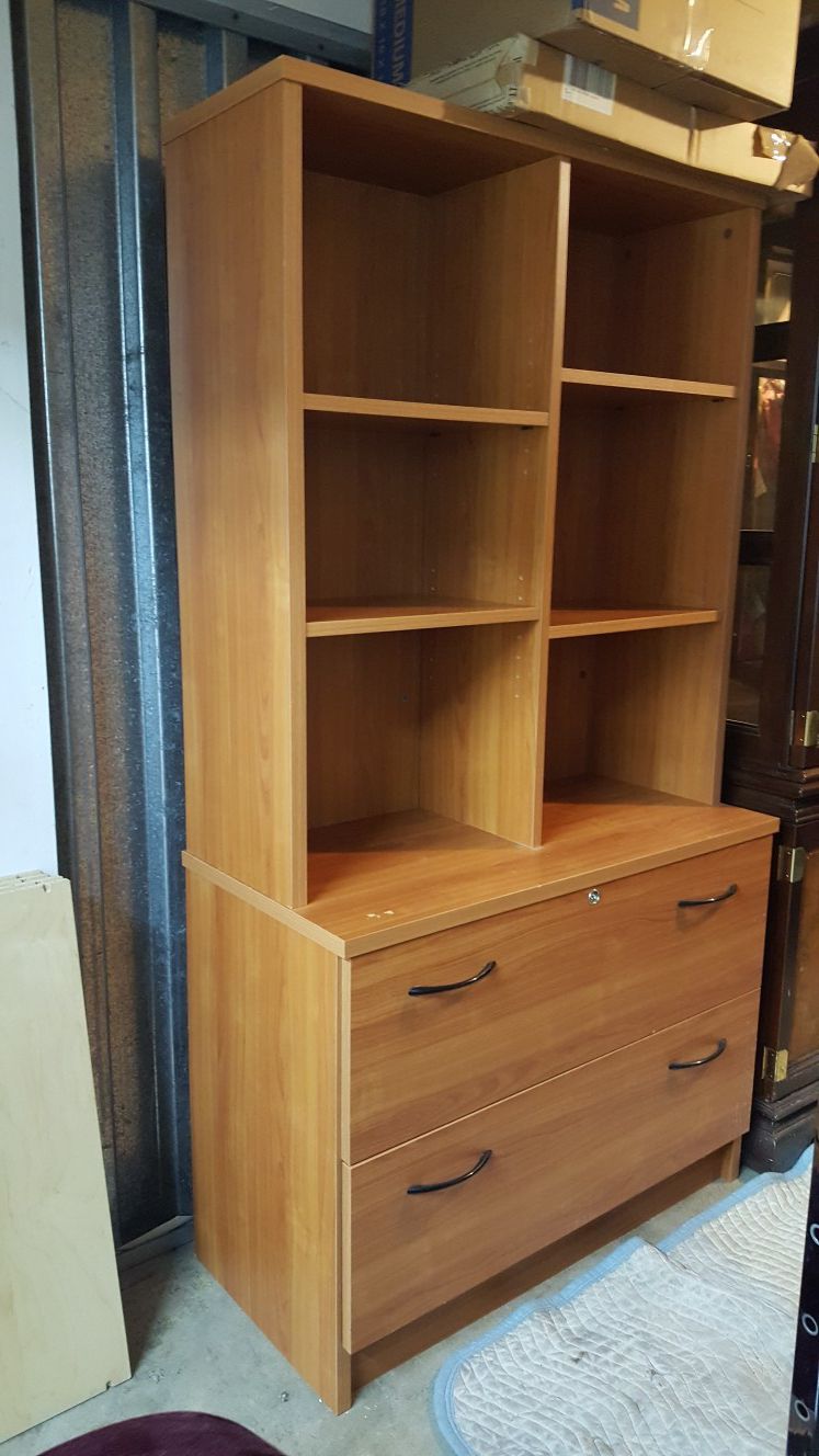 File cabinet with top shelves.