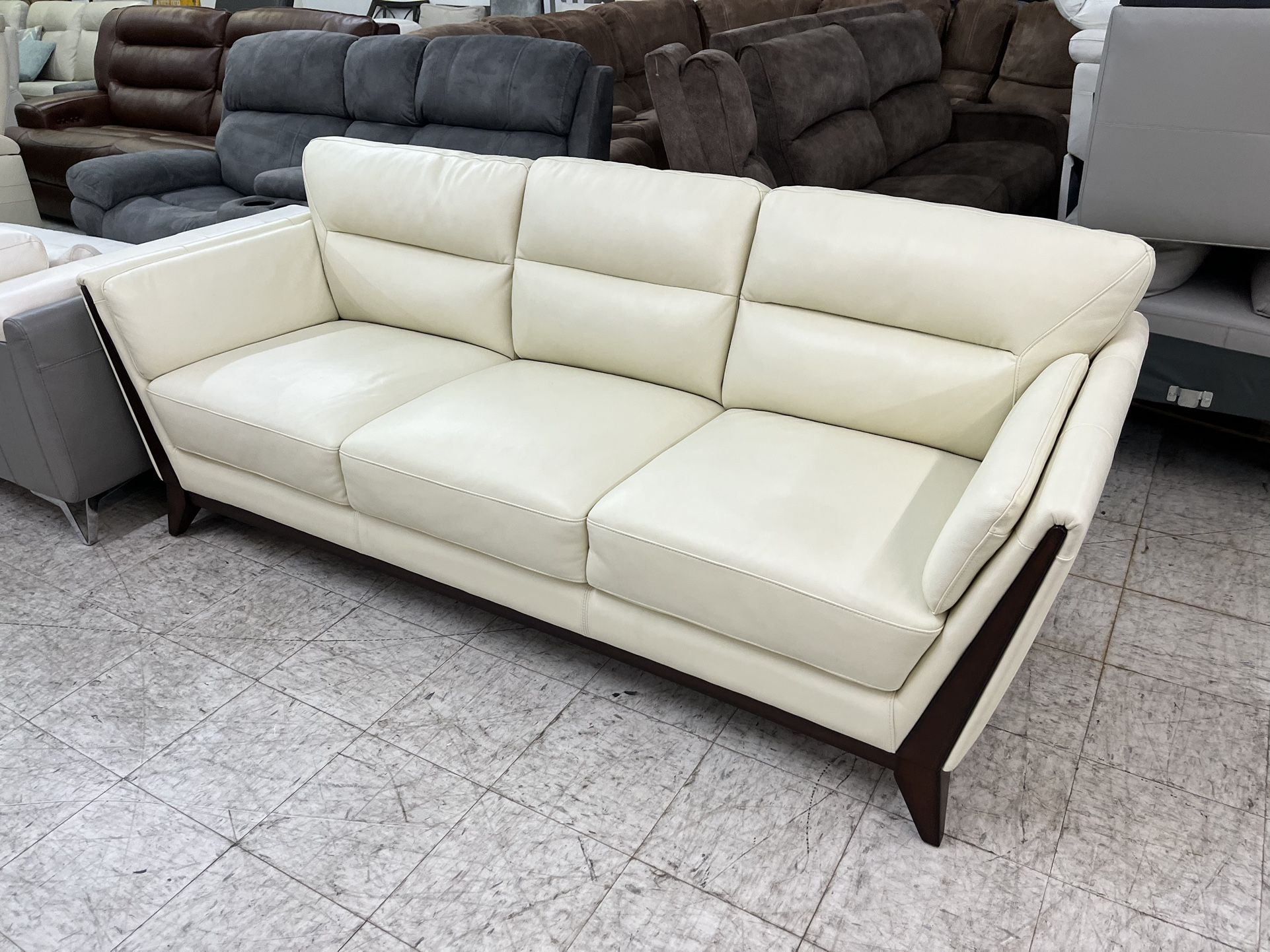 White Leather Sofa With Brown Wooden Trim 