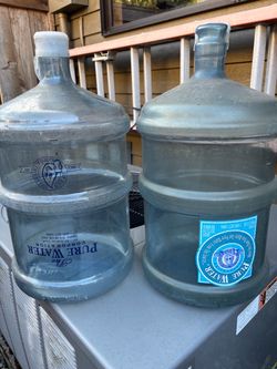 2 - 5 gallon plastic water bottles