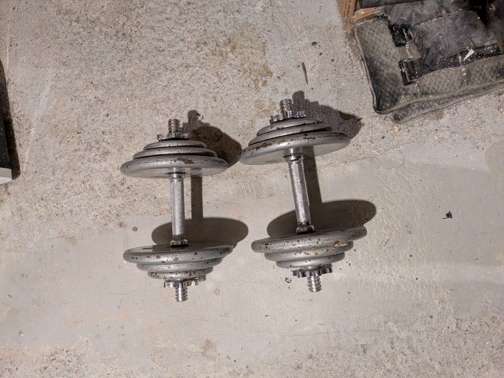 70 lb. Of Standard Weights On Dumbbell Star Lock Handles.