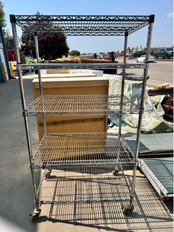Multiple heavy duty rolling shelving unit.