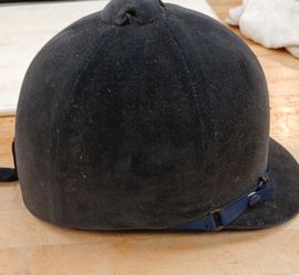 Young ladies riding helmet.