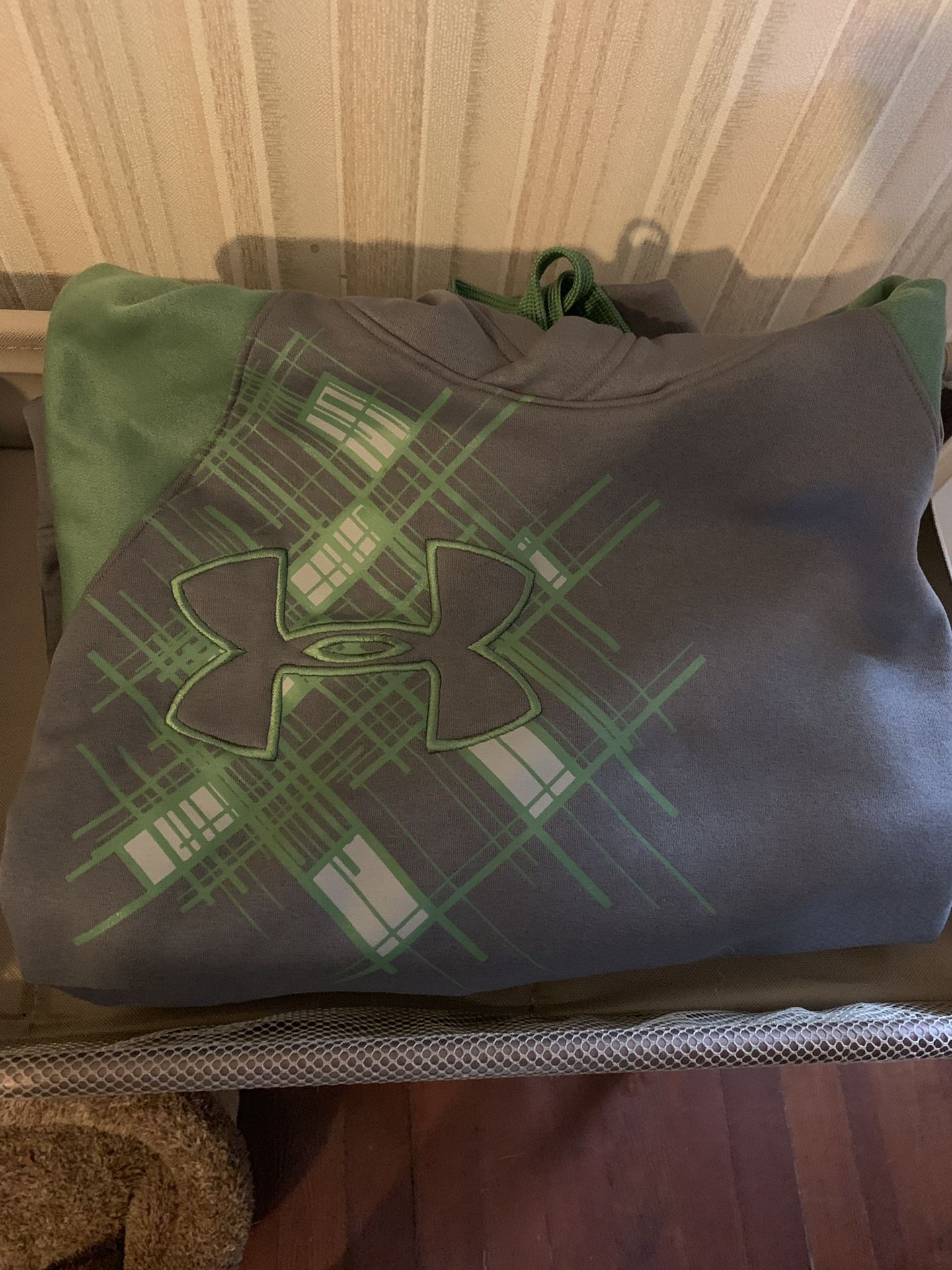 green & grey under armour sweatshirt. Loose fit small -med.
