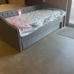 Brand New Day bed with mattress is $550