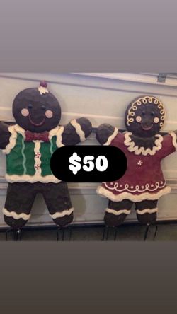 Antique gingerbread girl and boy yard decor