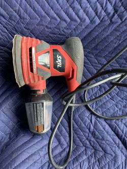Skil palm sander with dust bag