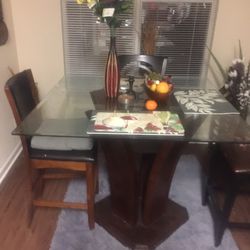 Dining set, desk, tv with stand, and sofa.