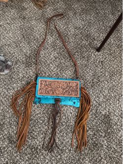 Turquoise hair on hide fringe purse