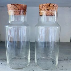 Set of 2 Vintage 70s Clear Glass Apothecary Jar/Canisters w Cork Lids 8” tall x 3 3/8” wide at the bottom