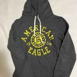Grey American Eagle hoodie with yellow accents Size M