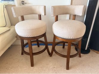Two beige countertop, high chairs