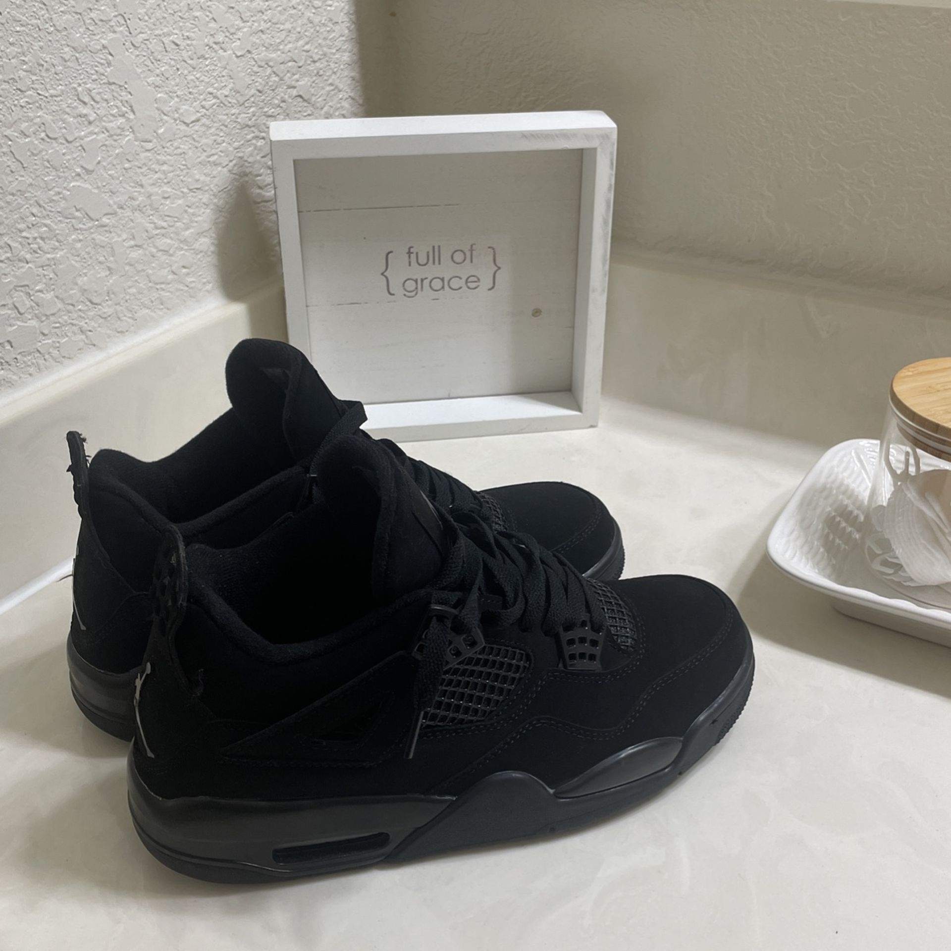 Black Cat Jordan 4s