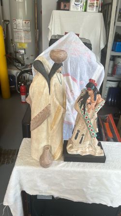 Indian motif metal statues 23 1/2” & 18 1/2” tall