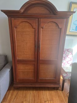Wood and Rattan armoire cabinet
