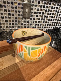 Ramen bowl with chopsticks