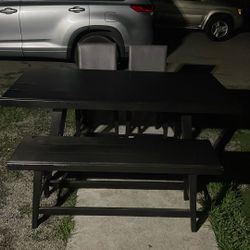 Table with bench and two chairs 