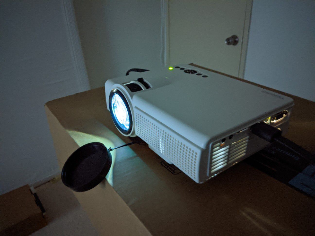 Watching movies on big screen! 2000 lumens home projector! Brand new!