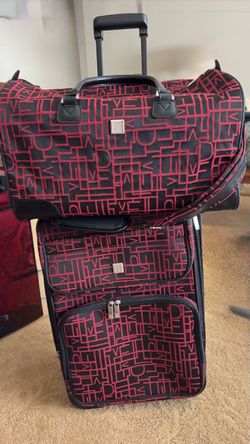 Rolling carry on luggage and a duffle bag