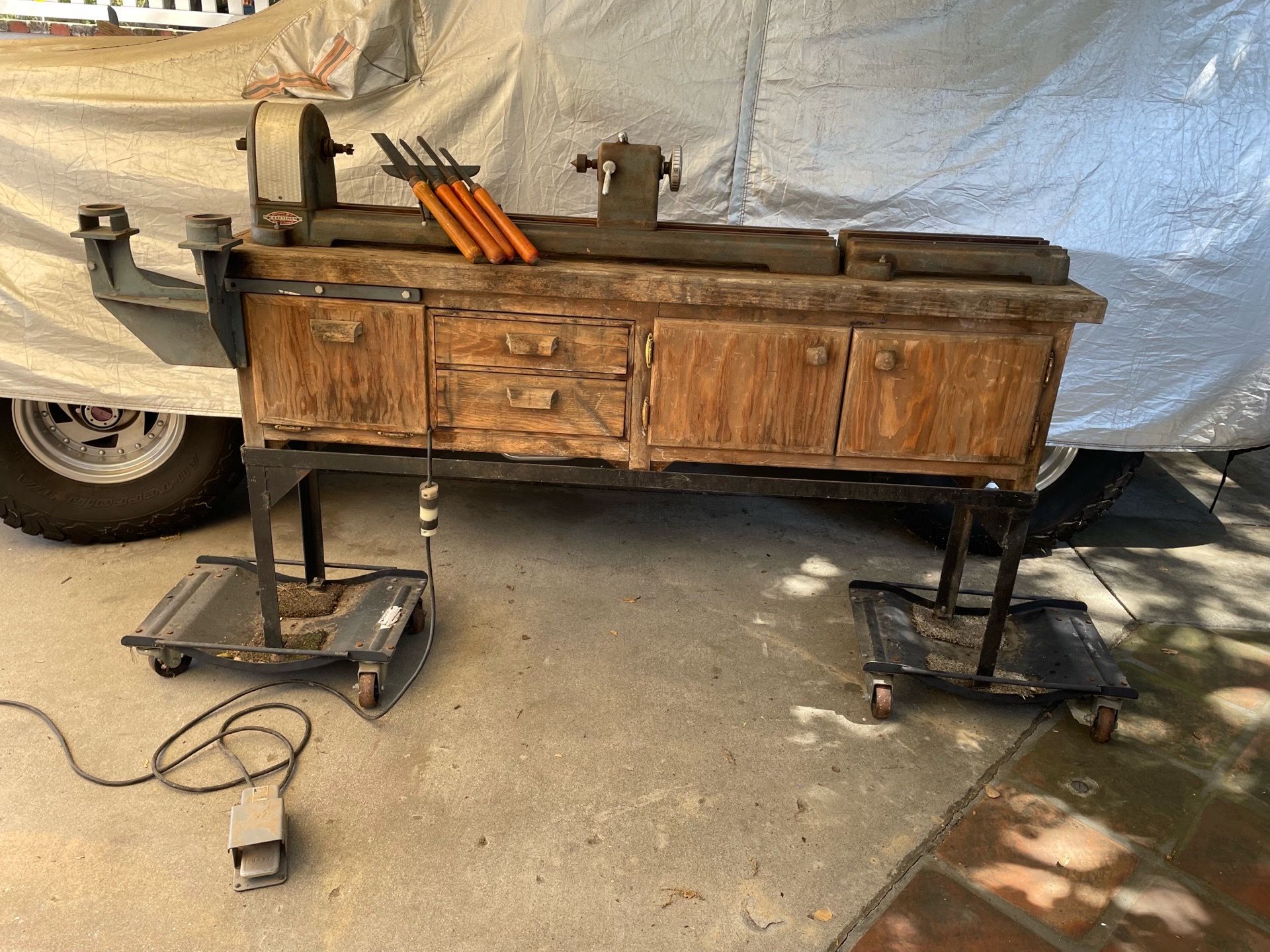 Vintage Craftsman wood lathe mounted on a custom workstation
