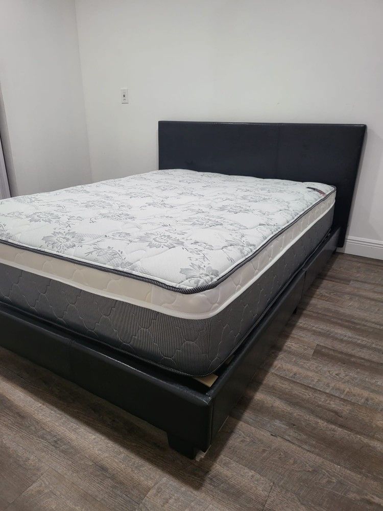NEW QUEEN UPHOLSTERED BED FRAME. Mattress sold separately