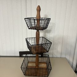 3 Tier Fruit Bowl Countertop Fruit Vegetable Bread Basket Display Storage wood and metal Stand. The item is pre owned in great cosmetic condition with