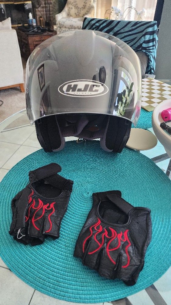 Two Motorcycle Helmet And Gloves