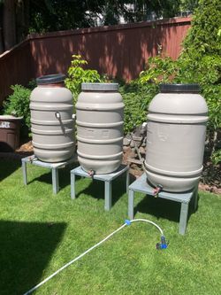 Rain water barrels one with stands left