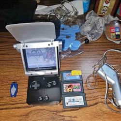 Nintendo Game Boy Advance SP bundle w/ 4 games + car charger + other accessories