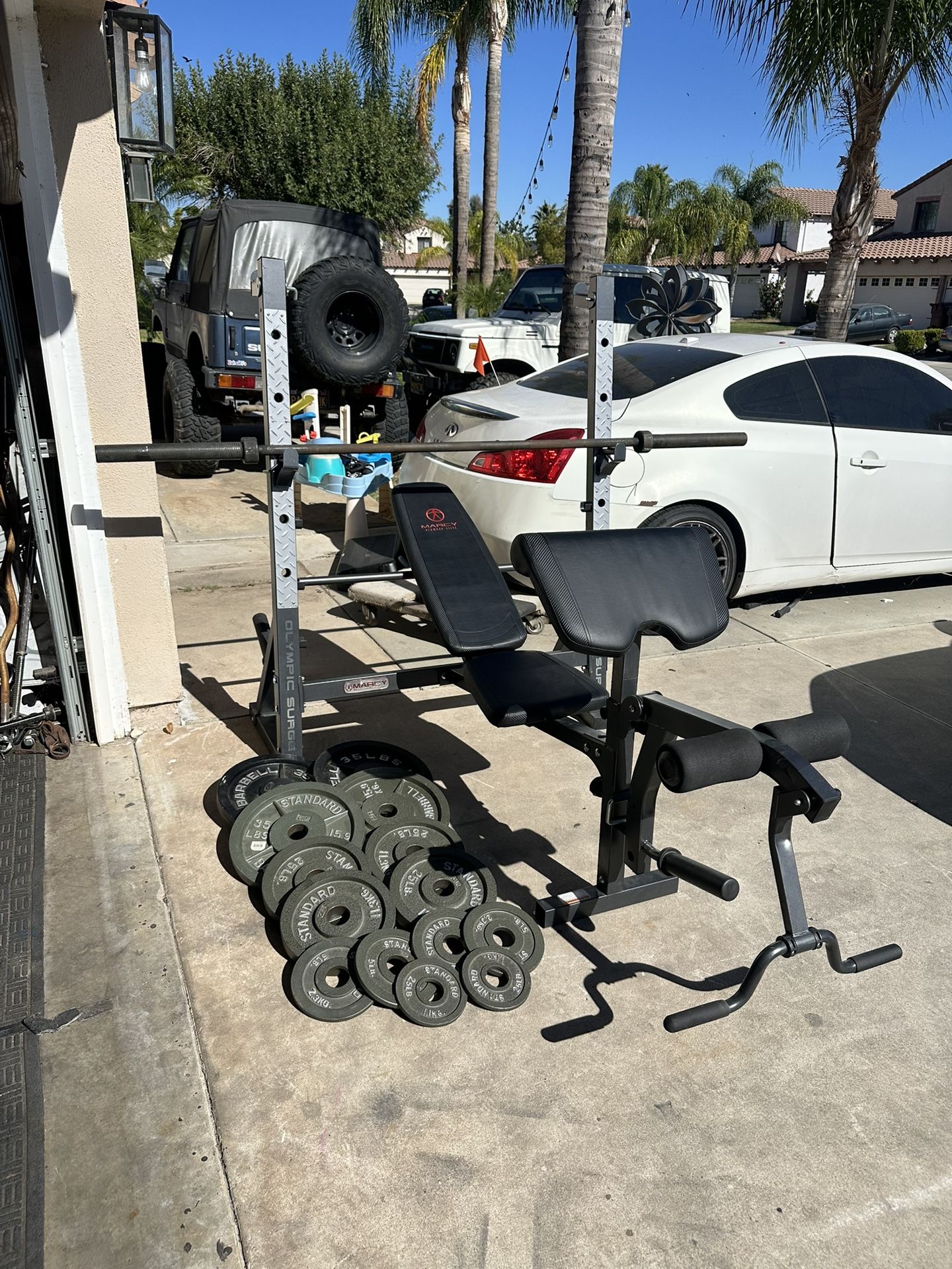 Bench press/squat rack with 7ft 45lbs bar plus 265lbs of Olympic weights