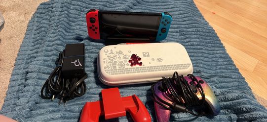 Nintendo switch oled with docking station, extra controller, Joycon grip and case. No trades cash only no Zelle, Cash app, Venmo, or PayPal.