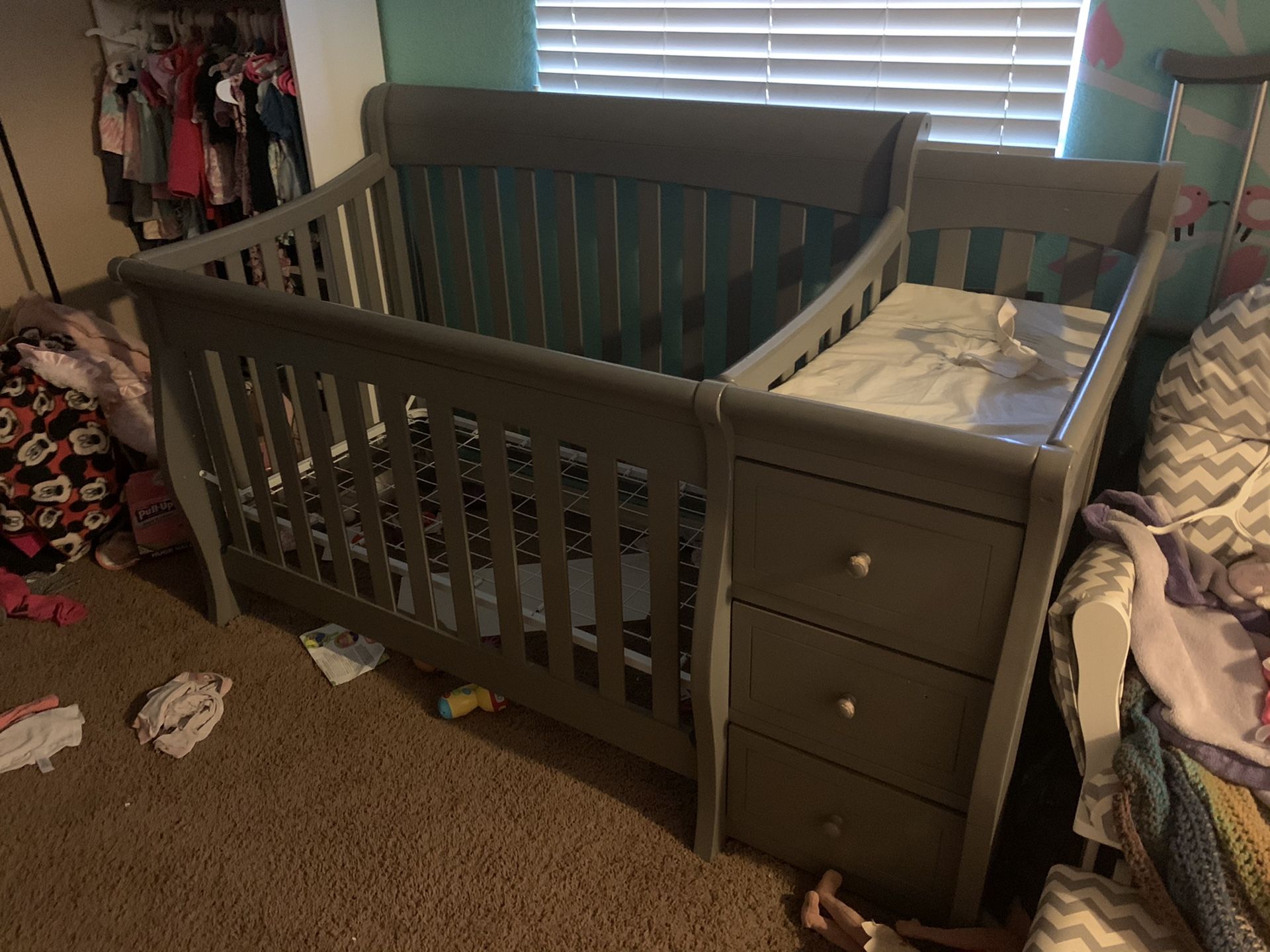 Baby crib with changing table