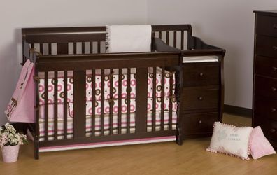 Baby crib with changing table