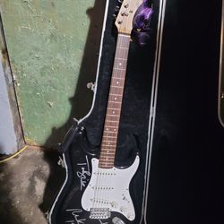 Autographed Squire Guitar, signed by all the members of Blink 182 Tom, Travis and Mark