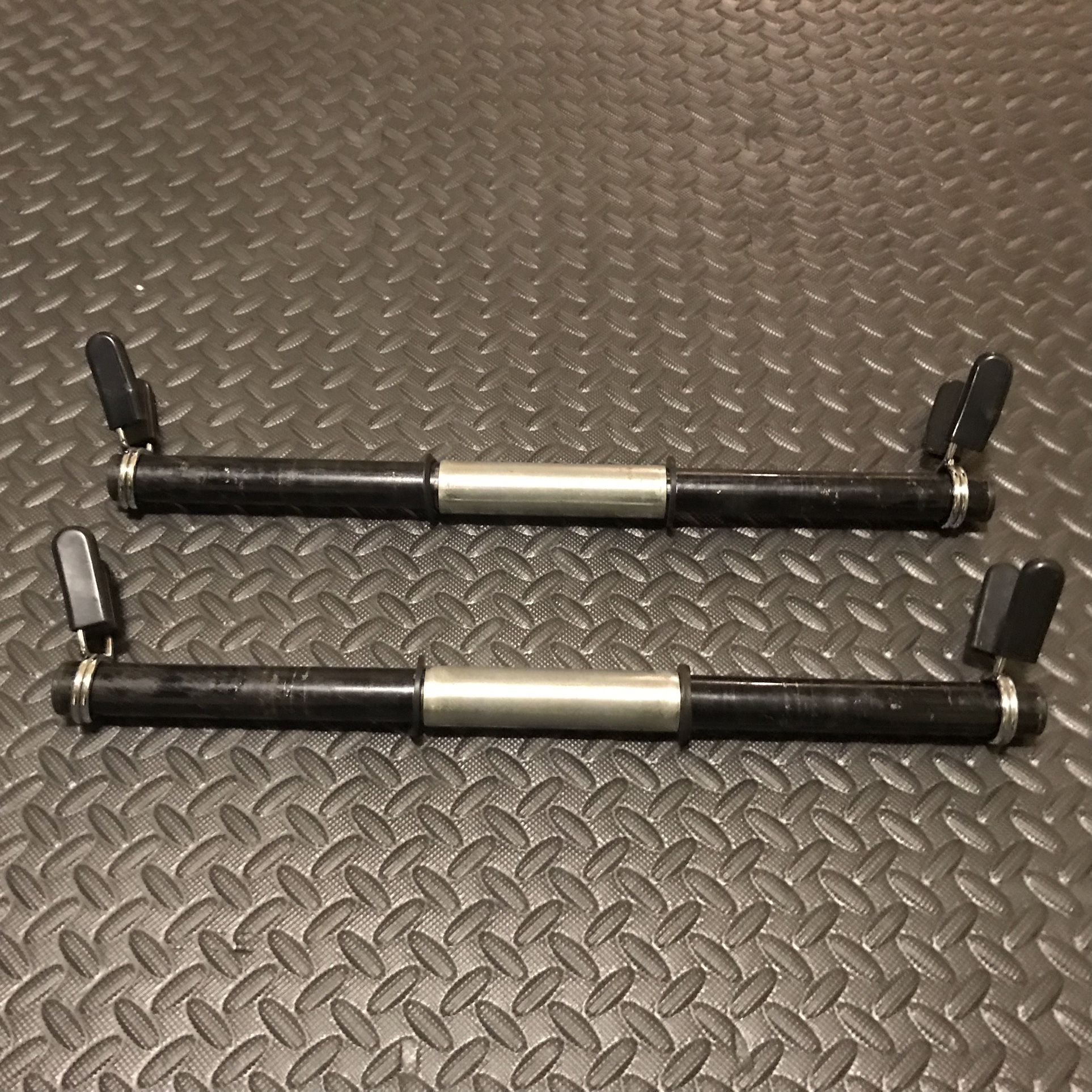 Dumbbell handle 1” pair(2),hollow metal with end caps, and center rotating sleeve,18”, 1 1b. per handle with spring clips.