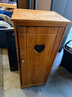 Antique ironing board hideaway cabinet