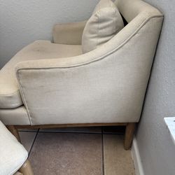 White chair with leg rest