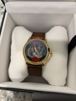 Barely worn Gucci watch in orginal box and comes with warranty and maintenance guide book