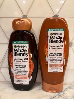 New Garnier Whole Blends Coconut Oil & Cocoa Butter smoothing shampoo and conditioner. Each bottle is 12.5 fl oz