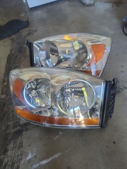 factory OEM headlights from a 3rd Generation facelifted 2006–2008 Dodge Ram (1500