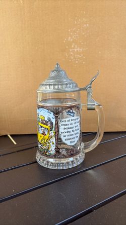 Glass beer mug with pewter lid