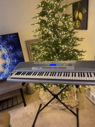 Yamaha Portable Grand 76-Key Electronic Music Keyboard with Portable Stand & Charger