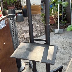 black metal mobile TV cart with locking caster wheels