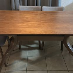 Walnut dining table with  6 matching chairs