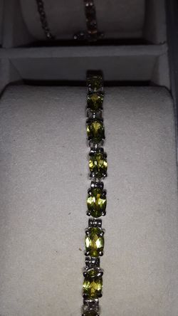 Peridot tennis bracelet set in Sterling silver.